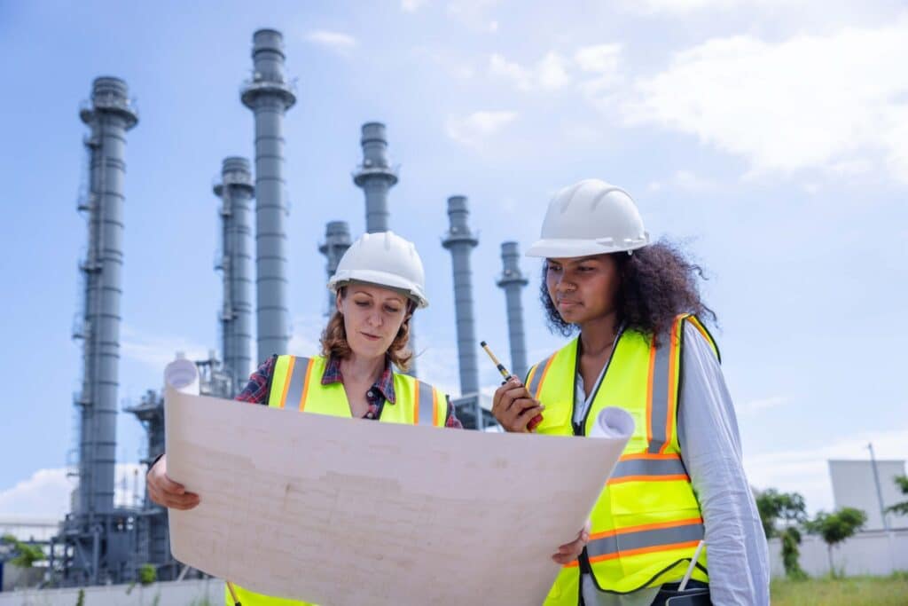 female engineers reviewing blueprints at a power p 2024 12 07 23 30 52 utc